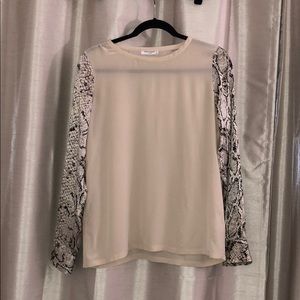 Beautiful silk cream blouse with snake skin sleeve